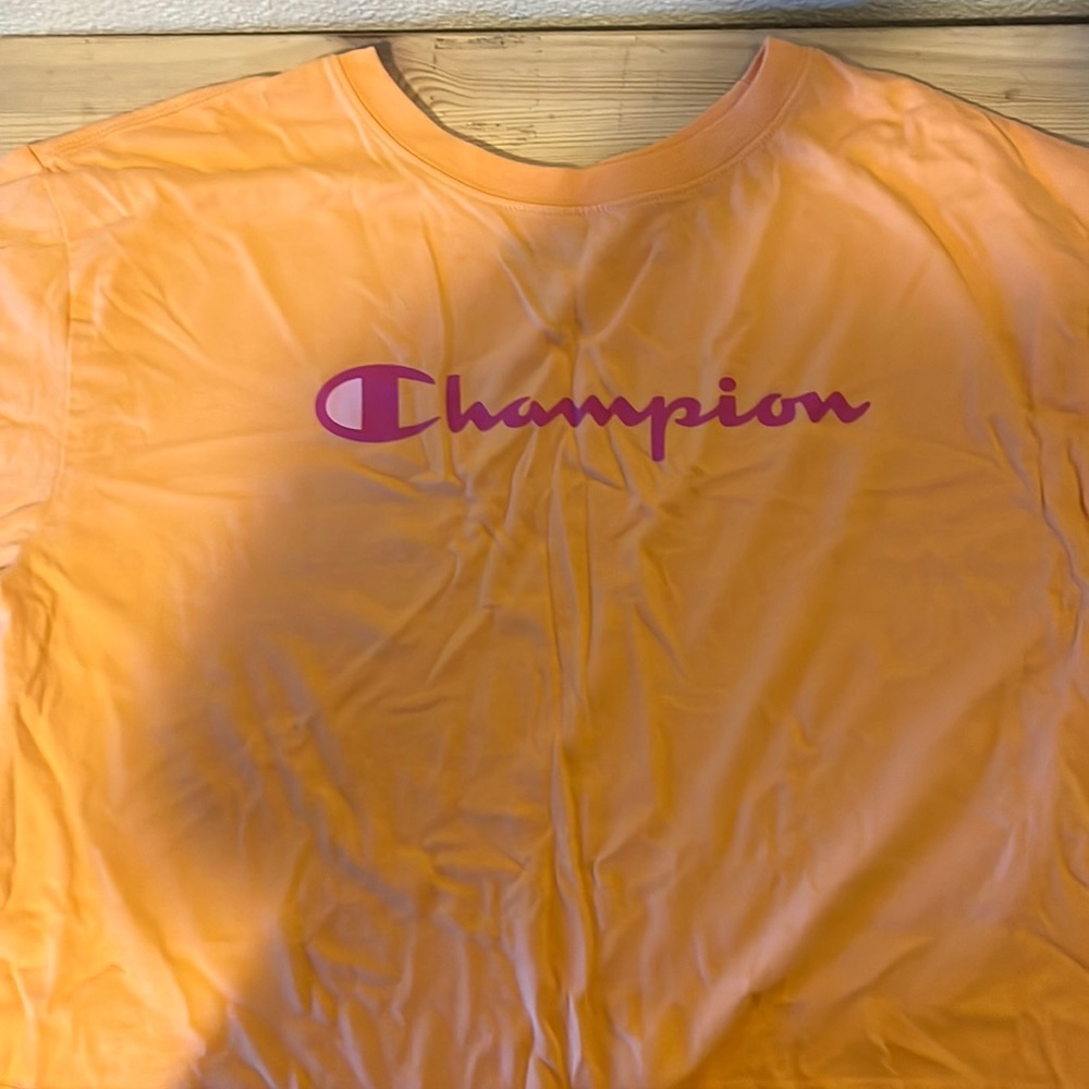 This is an orange, Champion, crop top that I got off Amazon.